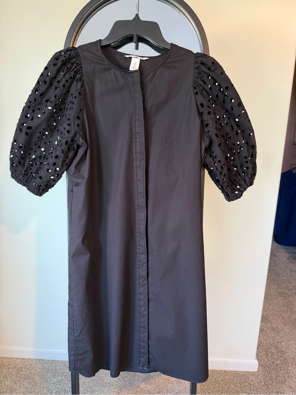 H&M Black little black dress with eyelet sleeves.  Simple but statement
